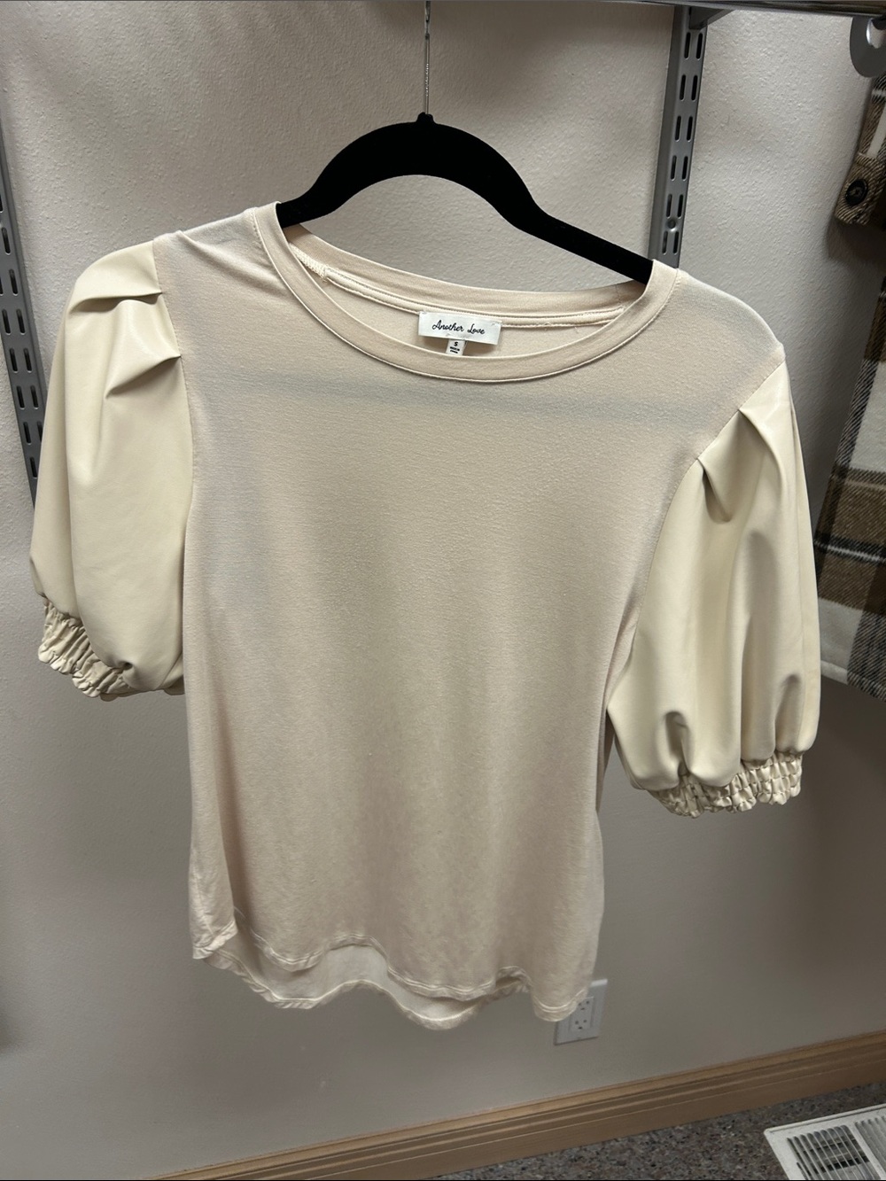 Another Love Cream Tee with faux leather Puff Sleeves.
